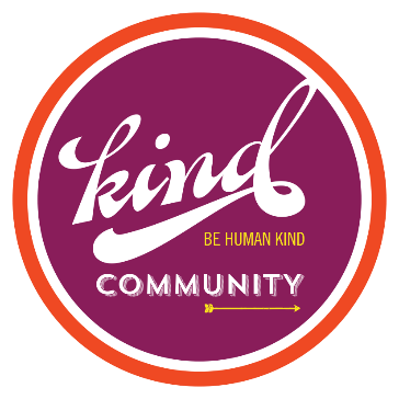 Logo featuring the word 'kind' in a cursive font with the phrase 'be human kind' above it and the word 'COMMUNITY' below, all enclosed within a circular design.